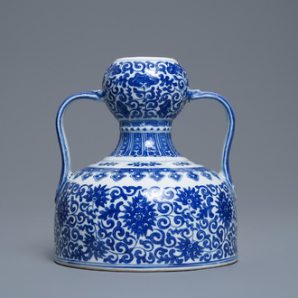 A Chinese blue and white two-handled 'lotus scroll' jug, Qianlong mark, 19/20th C.