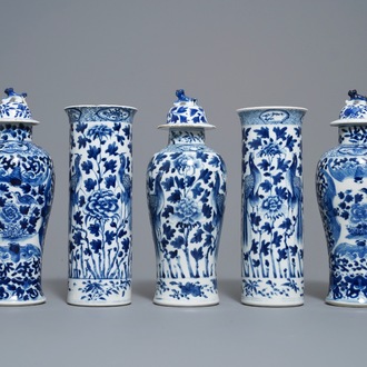 A Chinese blue and white five-piece garniture with peacocks, Kangxi mark, 19th C.