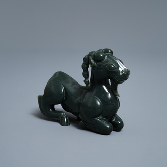 A Chinese spinach green jade model of a recumbent ram, 19/20th C.