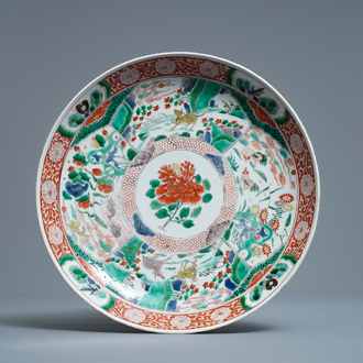 A Chinese famille verte charger with animals and flowers, Kangxi