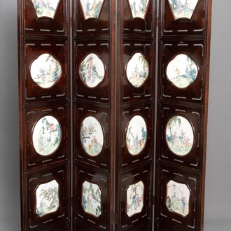A Chinese wooden room divider with famille rose 'Romance of the Western Chamber' plaques, Republic