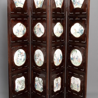 A Chinese wooden room divider with famille rose 'Romance of the Western Chamber' plaques, Republic