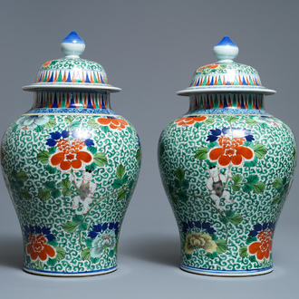 A pair of Chinese wucai vases and covers, Wanli mark, 19th C.