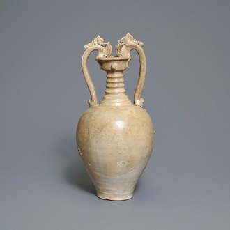 A Chinese cream-glazed stoneware amphora with dragon handles, Sui/Tang