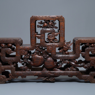 A Chinese finely carved wooden display stand, 19th C.