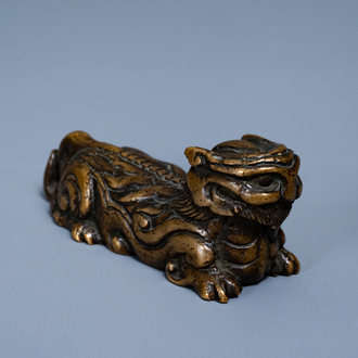 A Chinese bronze 'mythical beast' scroll weight, Ming