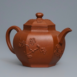 A Chinese Yixing stoneware teapot and cover with applied prunus design, Kangxi