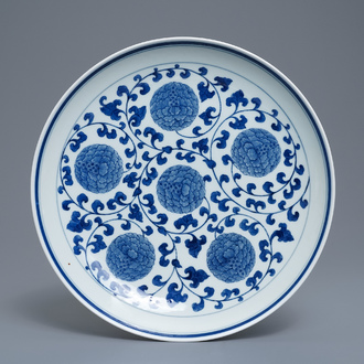 A Chinese blue and white 'peony scroll' dish, marked 'Made in Jingdezhen in 1955'
