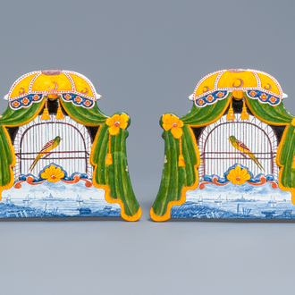 A pair of polychrome Dutch Delft trompe l'oeil birdcage plaques, 19th C.