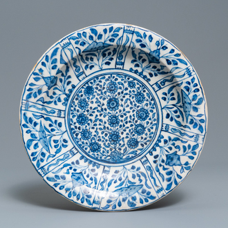 A Safavid parcel-gilt blue and white dish, Persia, 17th C.