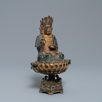 A Chinese polychrome and gilt bronze figure of Buddha on a lotus throne, Qing