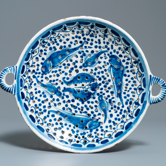 A large Dutch Delft blue and white fish strainer, 18th C.