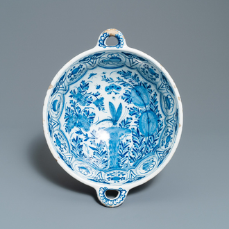 A large Dutch Delft blue and white two-handled chinoiserie bowl, 18th C.