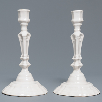 A pair of white Delftware candlesticks, 18th C.