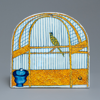 A polychrome Dutch Delft trompe l'oeil birdcage plaque, 18th C.