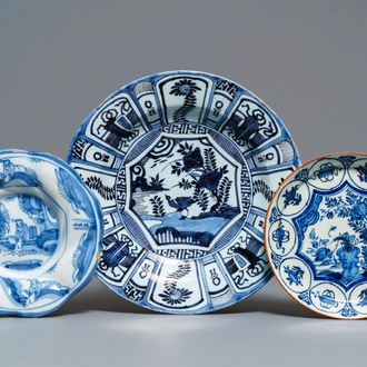Two Dutch Delft blue and white chinoiserie plates and a dish, 17/18th C.