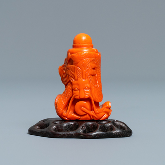 A Chinese carved red coral snuff bottle with a dragon, Republic