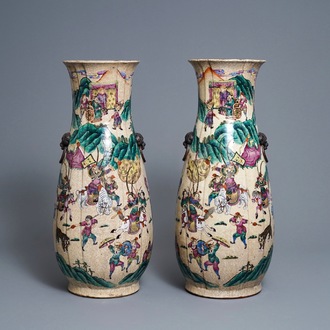 A pair of Chinese Nanking famille rose crackle-glazed 'warrior' vases, 19th C.