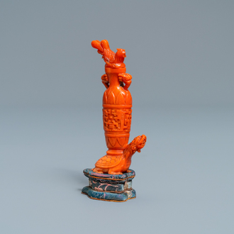 A Chinese carved red coral snuff bottle with a vase resting on a tortoise, Republic