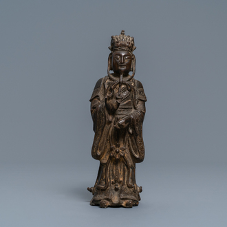 A Chinese bronze figure of a dignitary, Ming