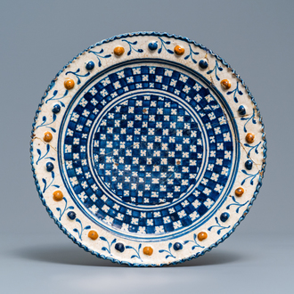 A polychrome Dutch maiolica 'checkerboard' dish, 1st quarter 17th C.