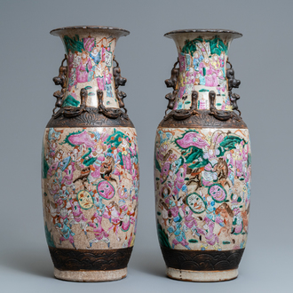 A pair of Chinese Nanking famille rose crackle-glazed 'warrior' vases, 19th C.