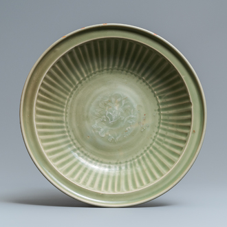 A Chinese Longquan celadon dish with incised floral design, Ming