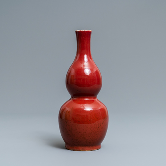 A Chinese monochrome sang-de-boeuf double gourd vase, Qianlong mark, 19/20th C.