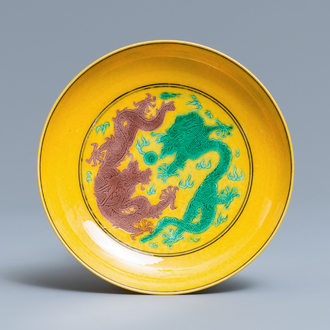 A Chinese yellow-ground green and aubergine 'dragon' dish, Jiaqing mark, 19/20th C.