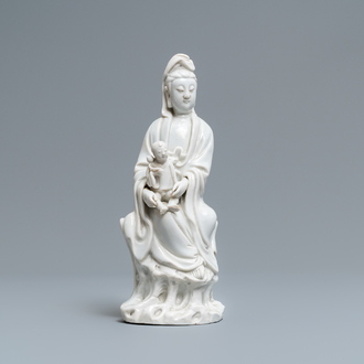 A Chinese Dehua blanc de Chine model of a Guanyin with child, Kangxi