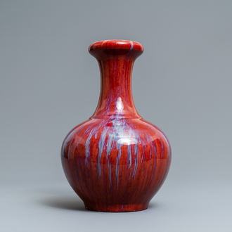 A Chinese monochrome flambé sang-de-boeuf bottle vase, 19th C.
