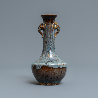A Chinese flambé-glazed vase with elephant head handles, 18/19th C.