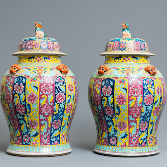 A pair of large Chinese famille rose vases and covers, 19th C.
