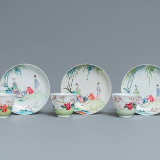 Three Chinese famille rose cups and saucers with figures in a garden, Yongzheng