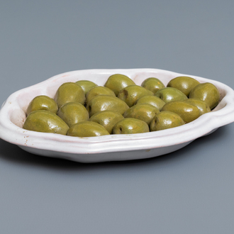 Un plat en faïence à décor trompe-l'oeil d'olives, Moustiers, France, 18ème