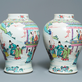 A pair of Chinese famille rose vases with figures in a garden, Yongzheng