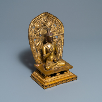 A Sino-Tibetan gilt bronze and copper repoussé figure of Buddha, 17/18th C.