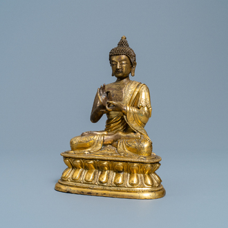 A Chinese gilt bronze figure of Buddha, 17th C.