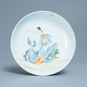 A Chinese famille rose dish with a lady in a landscape, Yongzheng