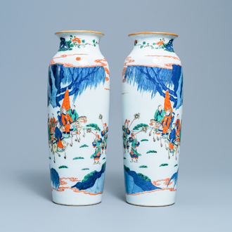 A pair of Chinese wucai rouleau vases with figures on horseback, 19th C.