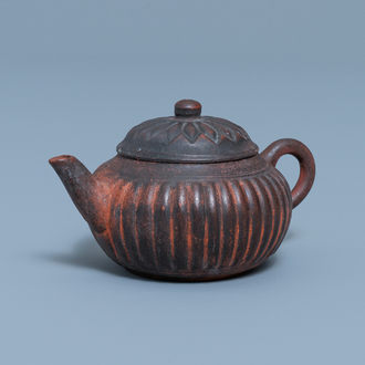 A Chinese Yixing stoneware 'chrysanthemum' teapot and cover, seal mark, Qianlong