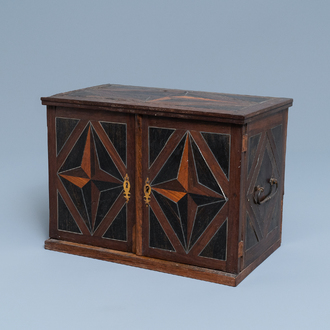 A Dutch wood marquetry and bone inlay table cabinet, 17th C.