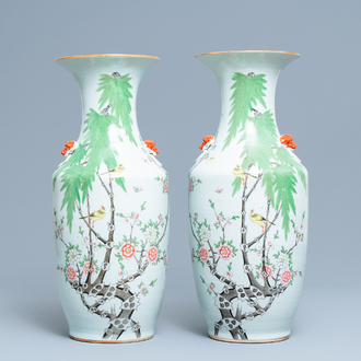 A pair of Chinese famille rose vases with birds among blossoming branches, 19/20th C.
