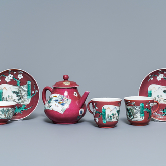 A Chinese famille rose ruby-ground teapot, three cups and two saucers, Yongzheng