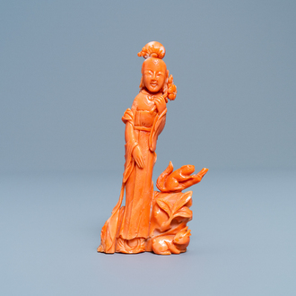 A Chinese carved red coral group of a lady, a squirrel and a rabbit, 19/20th C.