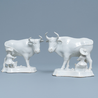 A pair of white Dutch Delftware groups of cows with milkers, 18th C.