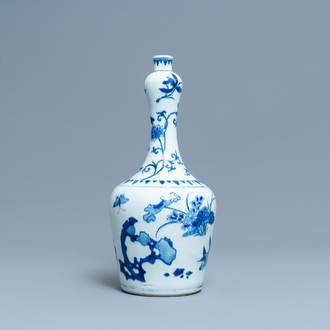 A Chinese blue and white bottle vase with floral design, Transitional period