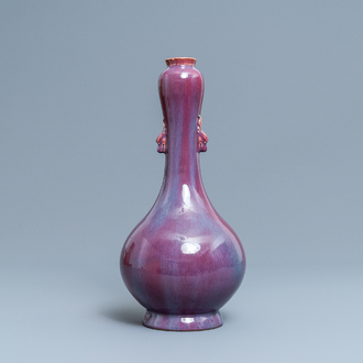 A Chinese monochrome flambé-glazed garlic head vase, 19th C.
