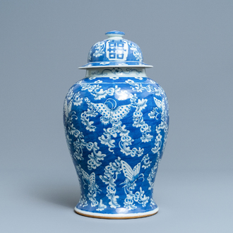 A Chinese blue and white 'butterfly' vase and cover, 19th C.