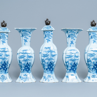 A Dutch Delft blue and white five-piece garniture with floral chinoiserie design, 18th C.